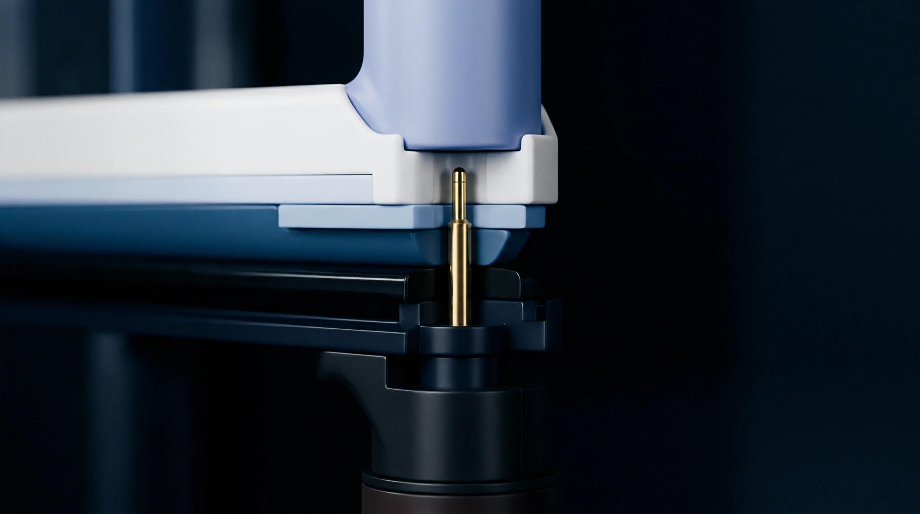 A gold finished spring pin stands vertically between blue and white polymeric components inside an energy storage module.